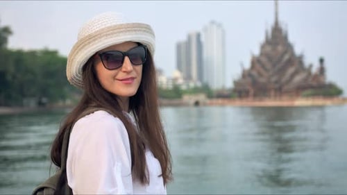 Young Traveler Enjoying a View of Buddhist Temple