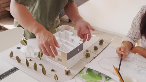 Architects Collaborate on Building Model in Studio