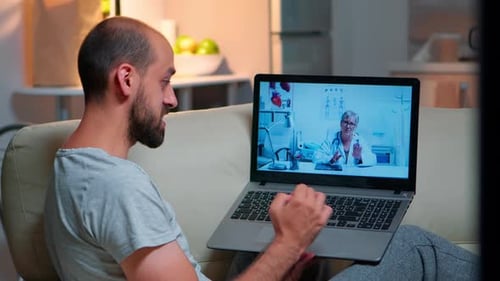 Man Consults Doctor During Virtual Appointment
