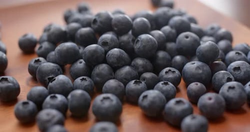 blueberry on wooden plate
