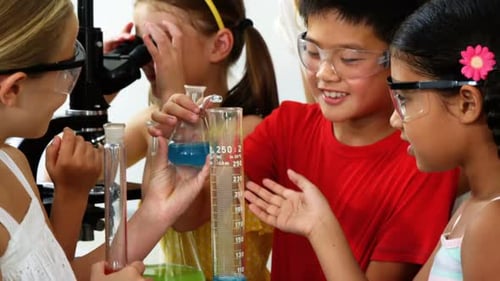 Children Conducting Science Experiment with Beakers and Liquids