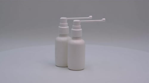 White Nasal Spray Bottles in Studio Setting