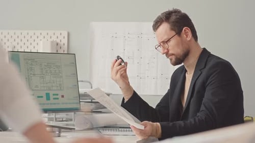 Serious Design Engineer Working in Office