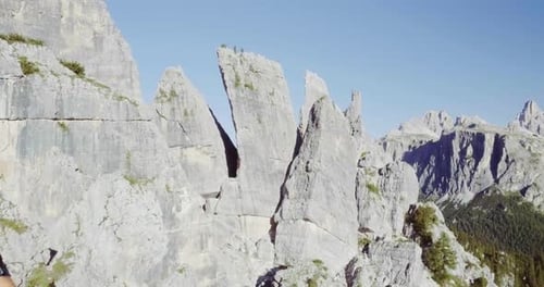 Aerial Flight Above People Hiking Along Trail Path in Sunny Day