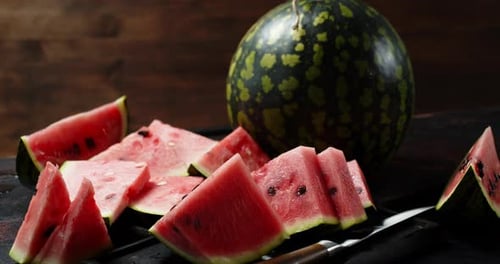 Ripe Watermelon Slices on a Wooden Table