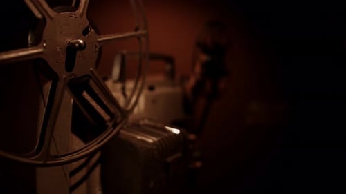 Vintage Metal Movie Projector in Dark Home Theater