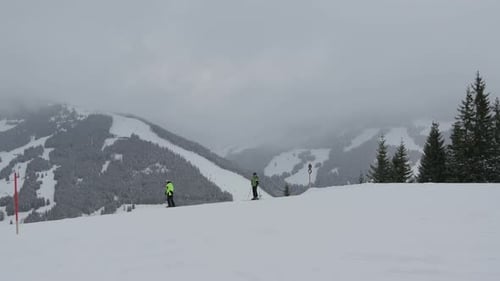 Tourists skiing at a ski resort on the mountain
