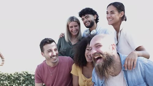 Group of Friends Laughing Together Outdoors in City