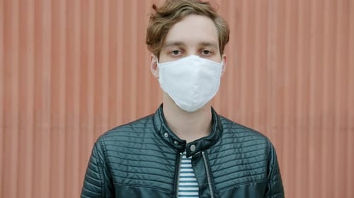 Young Adult with Mask Wearing Leather Jacket