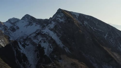 Snow covered peaks of the mountains in early spring