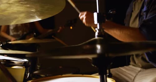 Drummer playing drum in studio