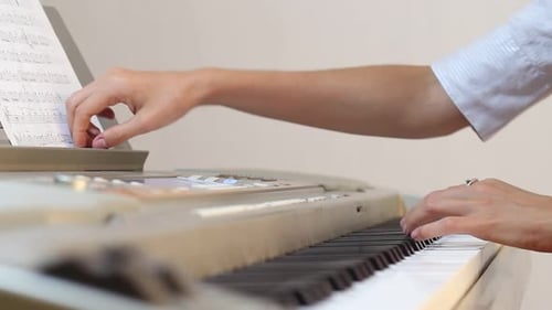 Hands Playing Keyboard, Writing Music Notation