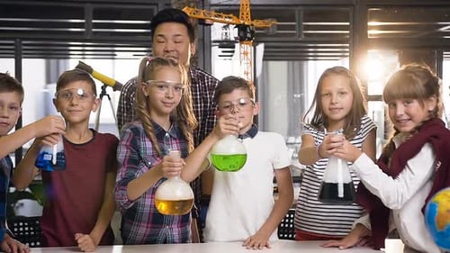 Enthusiastic Children Holding Colorful Flasks in Science Class