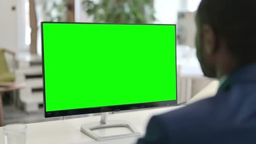 Businessman Using Desktop with Green Chroma Key Screen