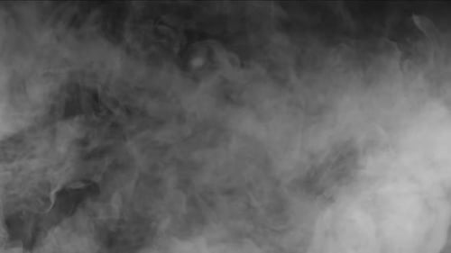 White Smoke Swirling on Black Background