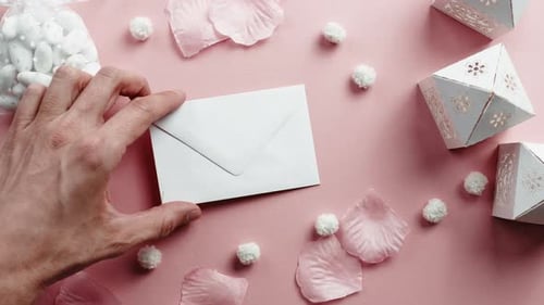 Romantic Pink Wedding Scene with Envelope