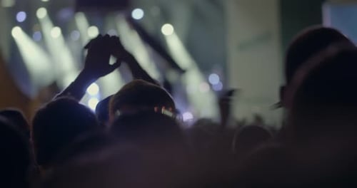 In MSU, Moscow on a concert We are together of musical group Kino crowd of people clap over head