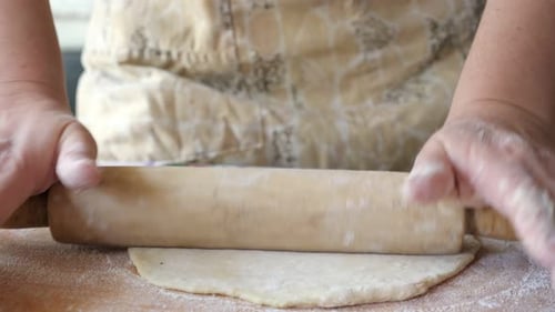 Adult Rolling Dough with Rolling Pin at Home