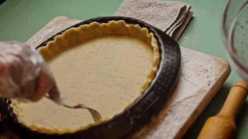 Hands Prep Pie Crust with Fork