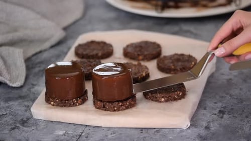 Chocolate Desserts being Assembled with Spatula at Home