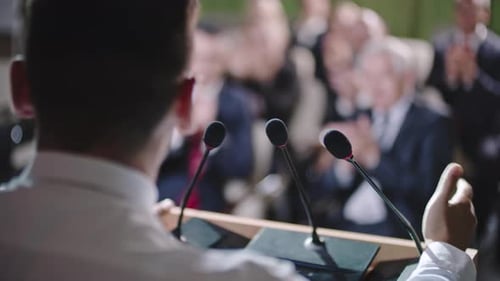 Speaker Addresses Audience at Corporate Event or Conference