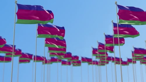 Seamless Loop of Waving Flags Against Blue Sky