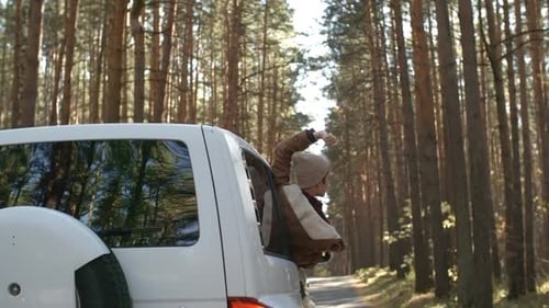 Woman Enjoying Forest Out of Car