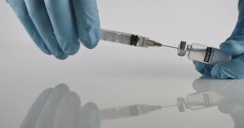 Vaccine Vial and Syringe Close Up