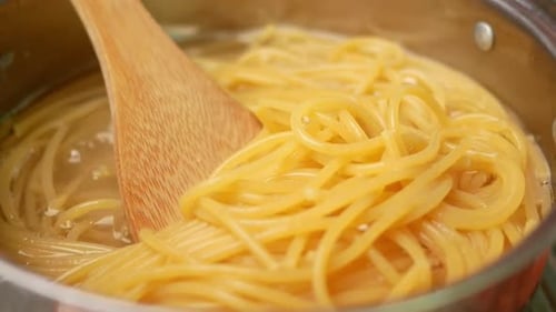 Stirring Spaghetti in Pot Close Up
