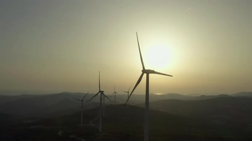 Aerial View of Environmental Energy Windmills in a Natural Landscape