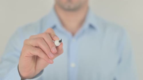 Man Writes the Word Idea on Glass
