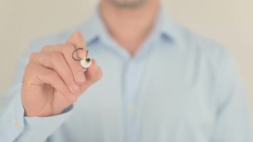 Man Writes Clean Energy On Clear Surface
