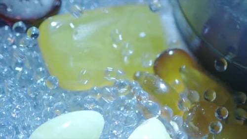 Colorful Polished Stones and Gems with Water Droplets