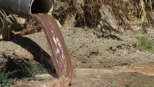 Sewage Coming Out of a Sewage Pipeline