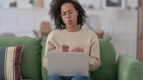 Woman Experiencing Wrist Pain While Using Laptop