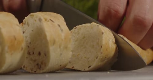 Close up Bread Roll Sliced with Knife
