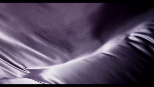 Abstract Gently Rippling Purple Fabric Motion