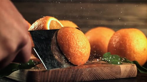 Cutting a Fresh Orange with a Knife
