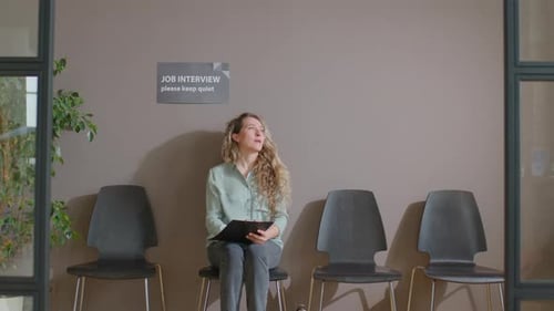 Woman Awaits Job Interview in Waiting Room