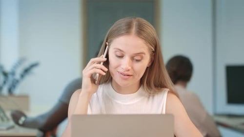 Young Woman Working at Laptop in Business Office Portrait of Concentrated Woman