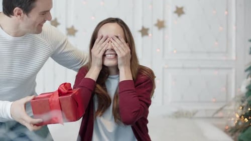 Woman Surprised by Christmas Present From Partner