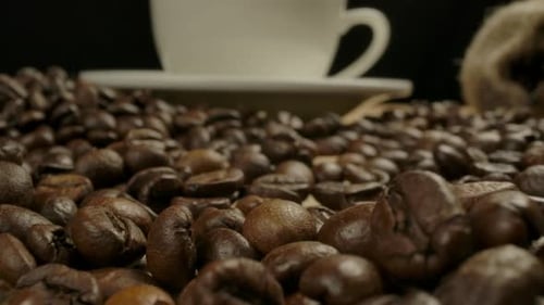 Coffee Beans and Cup Close Up Dolly Shot
