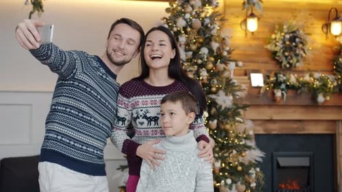 Family Christmas Selfie in Festive Home Interior
