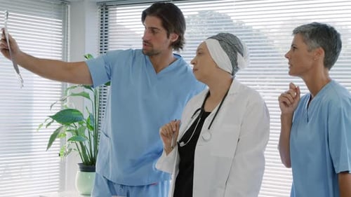 Doctors Examine X-Ray in Clinic