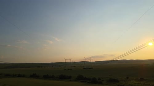 Powerlines in Rural Area at Sunrise or Sunset