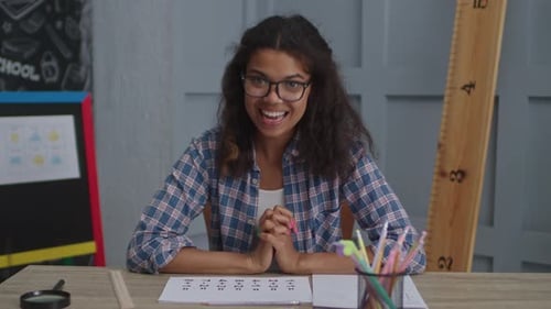 Young Woman Teaching Math in a Classroom
