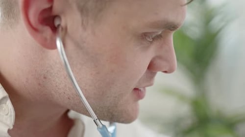 Young Adult Male Doctor with Stethoscope Close Up