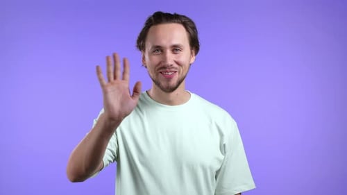 Young Adult Smiling and Waving Hello