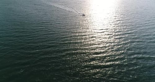 Aerial view of speed boats on the sea near beach city