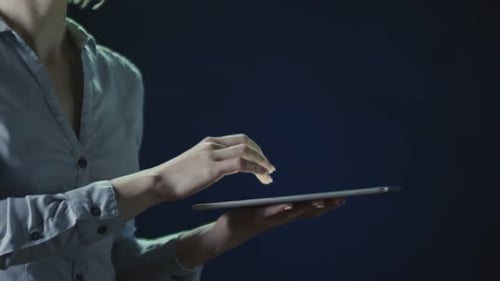 Woman Using Tablet for Business